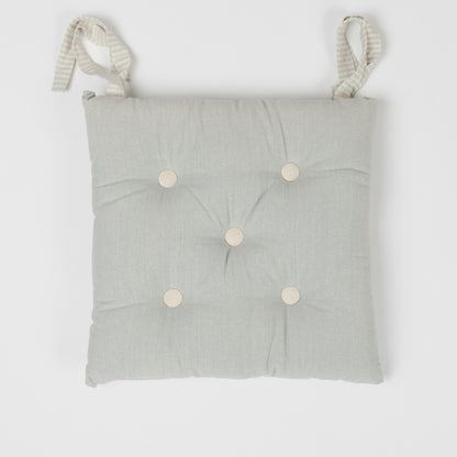CUSCINO IN COTONE TINTA UNITA CON BOTTONI 0031